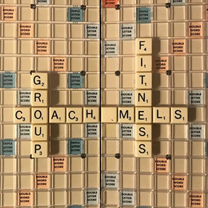 Scrabble board with Coach Mels Group Fitness spelled.